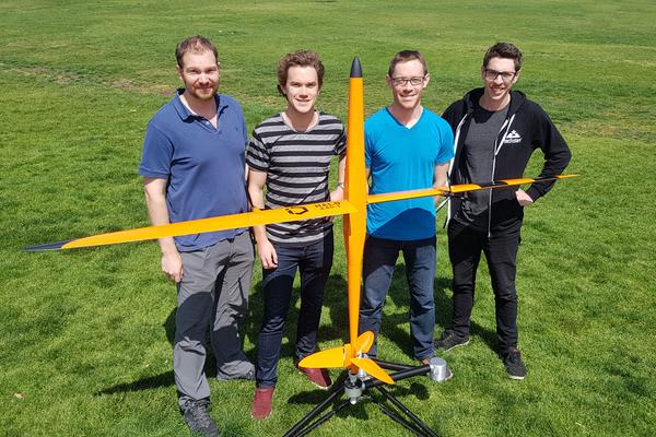 Iridium Dynamics CEO Ian Conway Lamb (second from left) with his Halo UAS and team. Credit: Iridium Dynamics