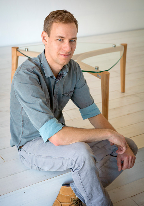 Maker and designer Ben Percy with his Mantis Coffee Table in Monterey cypress. Photo: Carol Gibbons