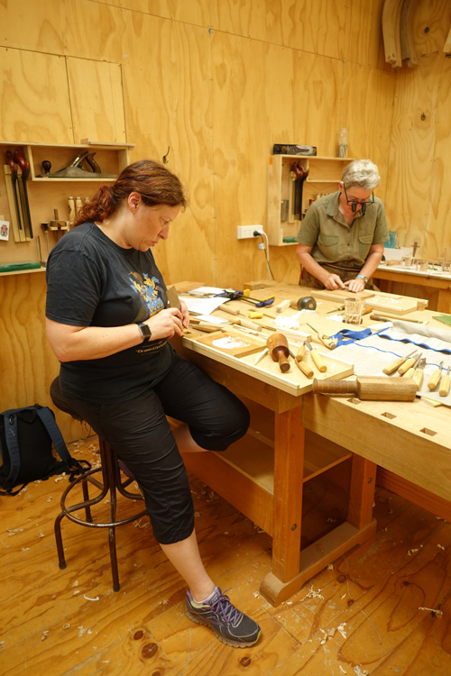 Two of the people who were fully absorbed in learning new skills at Geoff Kover's woodcarving class.