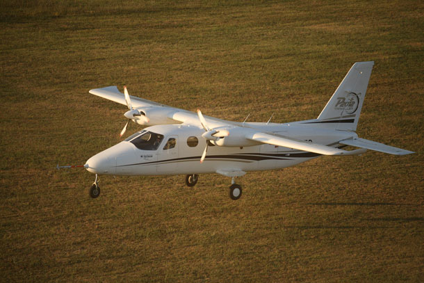 Tecnam's P2012 Traveller prototype approaches Capua's grass runway at the end of its maiden flight. (Tecnam)