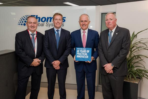 The Prime Minister with (from left) John Cary, member of Thomas Global&rsquo;s Advisory Board; Angus Hutchinson, CEO; and William Hutchinson, Chairman. Credit: Thomas Global Systems