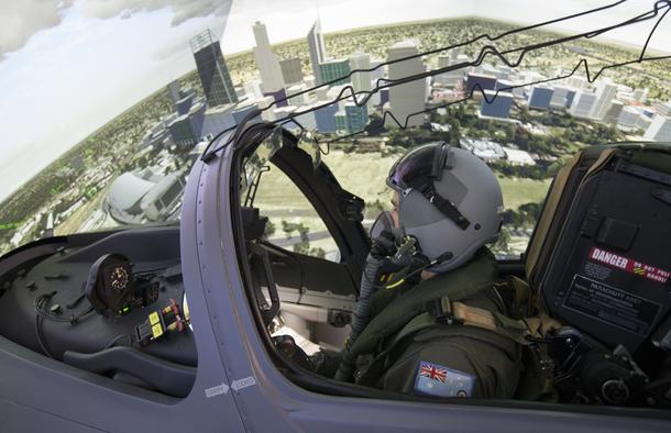 79 Squadron Trainee, Flying Officer Iain Roberts-Thomson, operates the Hawk Simulator on a training evolution over a simulated Perth at RAAF Base Pearce. Credit: Defence