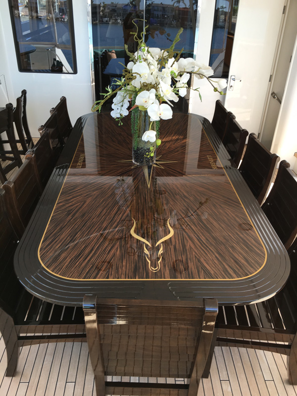 Gavin Harrington, Serengity dining table and chairs in wenge with cherry banding and marquetry motif.