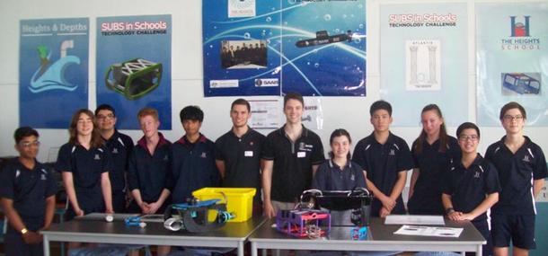 Saab ambassador Will Daniels surrounded by students from The Heights School in Adelaide. Credit: REA