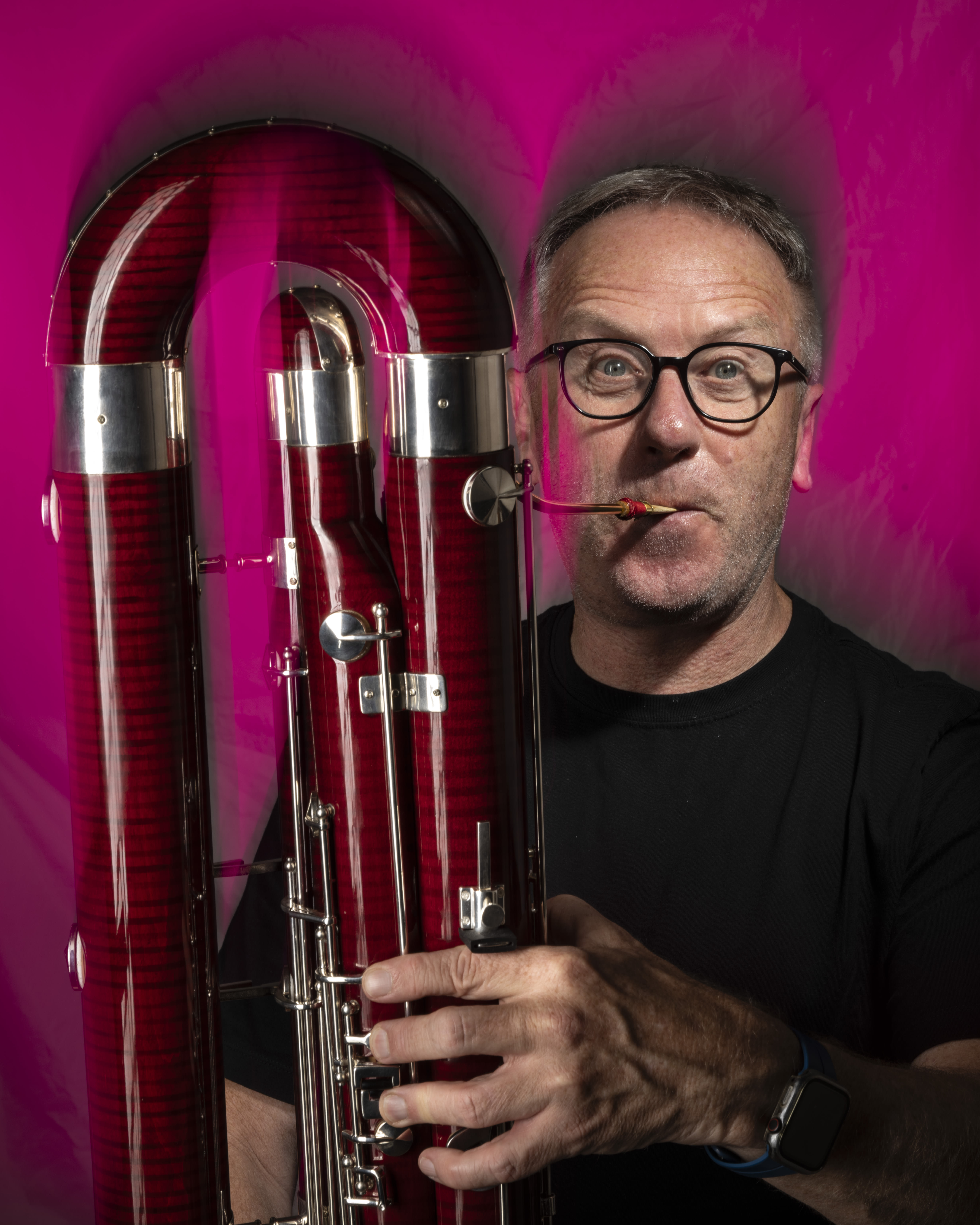 This portrait of Melbourne contra-bassoonist Andrew was made using a combination of continuous light and flash. An Amaran 300C continuous light poured magenta light into a large soft-box that I used for the background. Two flashes in smaller soft-boxes were then used to light Andrew’s face and his instrument. The key to getting the blur in the photo was to flick the camera upwards as I made the exposure. Nikon Z8, NIKKOR Z 24-120mm f/4 S lens @ 71mm. 1/5s @ f16, ISO 32.