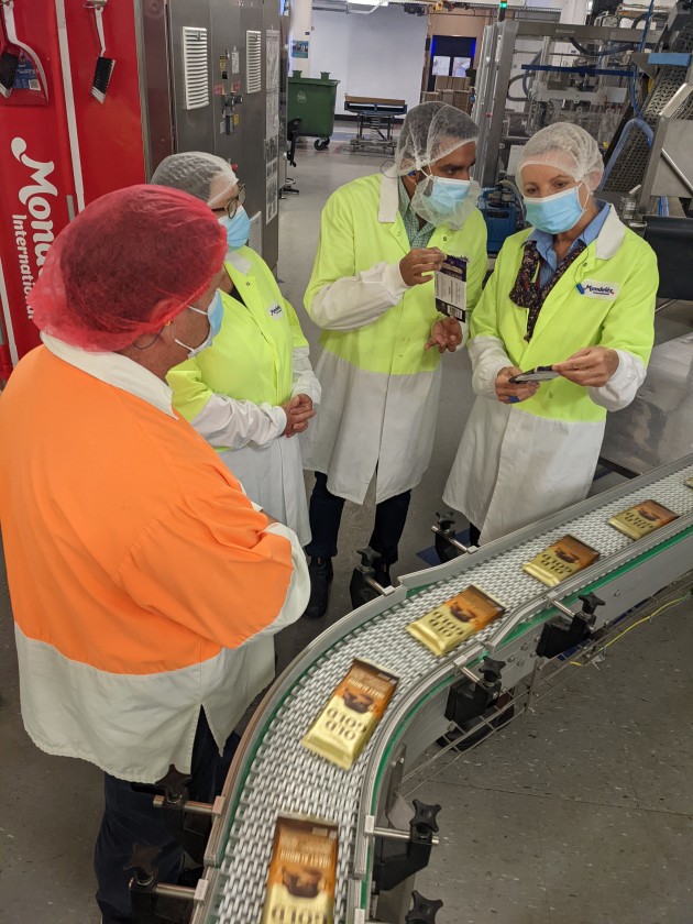 Cadbury packaging trials: From left Cadbury Australia's Jamie Salter, Andrea Jones and Usman Saeed, with Minister Ley.
