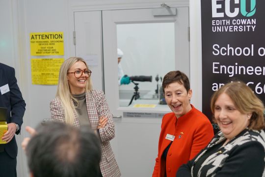 L to R: Defence Secretary, Caitlin Collins and ECU Vice-Chancellor Clare Pollock outside the sealed cleanroom.