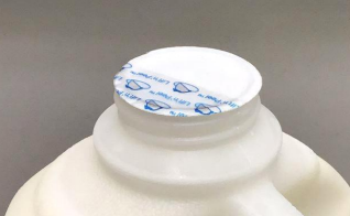 The tamper seals on Coles milk bottles are being removed in certain states.