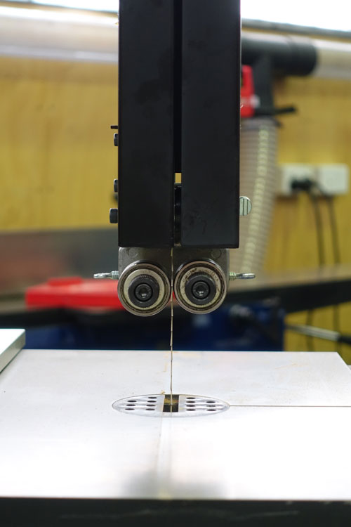 The machine has double-roller bearing guides top and bottom.