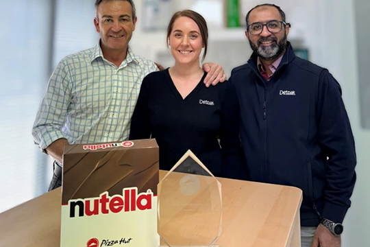 The Detpak Global Brands Team with the award (L-R): business manager Ben Suttell, account coordinator Tamara Lewis, and account executive Syed Hussain.
