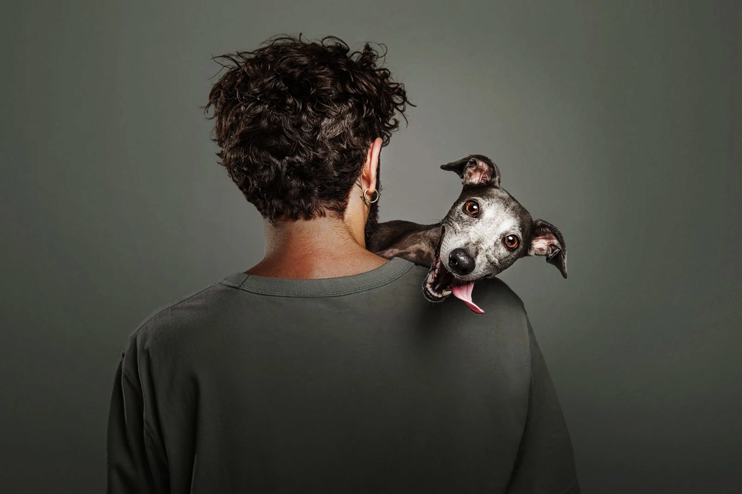 Third place in the Dogs and People category. ‘The Weight of Connection.’ | Photo by Santos Roman / Dog Photographer of the Year
