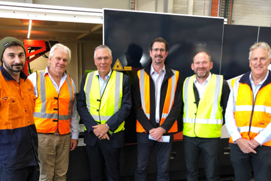 Foodmach laser cutter operator Keegan Phillips, Foodmach director Malcolm Nurse, Nationals leader and member for Murray Plains, Peter Walsh, Foodmach CEO Earle Roberts, and directors Phil Biggs and Dallas Coote.
