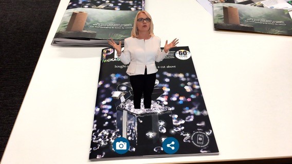 PKN publisher Lindy Hughson in AR, steps out of the PKN cover.