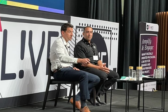 Jason Brown, managing director of ePac ANZ joined on stage by one of his clients, Brian Nasr, founder of Healthy Food Crew.