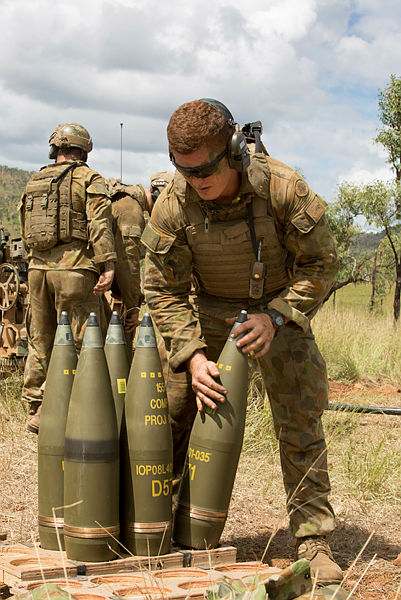 Australian Army soldiers from 8th/12th Regiment prepare rounds for the 155 mm M777A2 towed lightweight howitzer. Credit: Defence