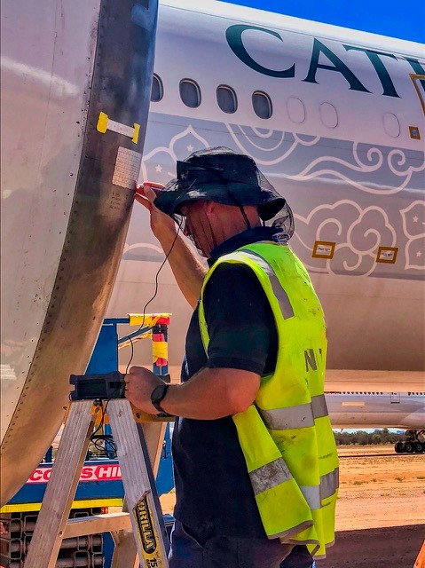 NDT work on wing Cathay Pacific 737. (Michael Gray/ APA)