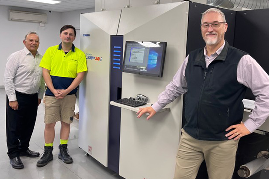 Strategic move into labels: Jean-Pierre De Waele (right), operations manager at Networkpak; with Ruvan Weereratne, technical account manager, Jet Technologies (left) and Sam Catalano, operator, at Networkpak (centre), with the new Screen L350UV SAI S