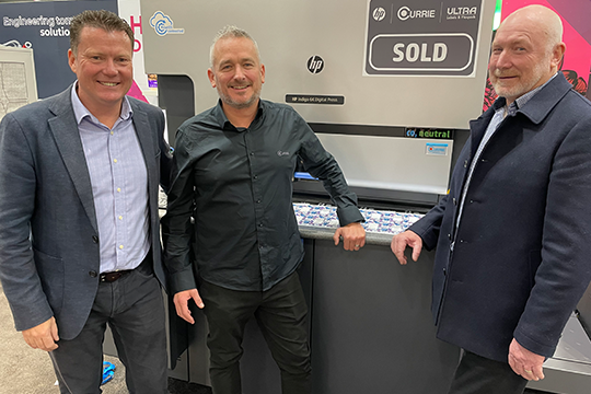 Another sale: Currie Group has sold the second HP Indigo 6K digital label press to Ultra Labels & Flexpack, announced at PacPrint. From left, HP Indigo's Craig Walmsley, Currie Group's Mark Daws, and Ross Fursey from Ultra Labels & Flexpack.