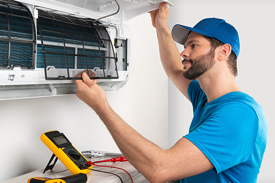 RAC technician working on a split system.