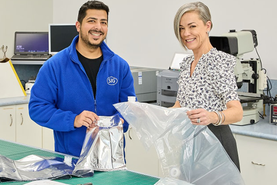 Carmen Houston, ANZ head of marketing & sustainability at SIG (right) with the new industry-first recycle-ready bag-in-box packaging for water.
Source: SIG
