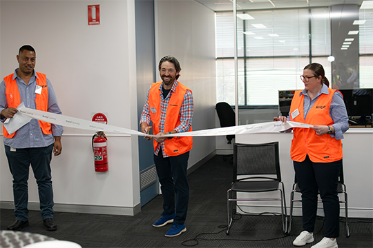 Court Carruthers, president and CEO of TricorBraun, cutting the ribbon to the new facility.