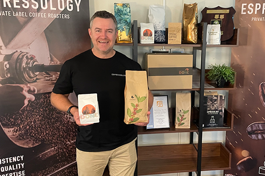 Ged Ryan, COO at Espressology, shows examples of customised coffee bags printed on the ColourStar AQ.