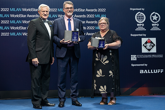 Pierre Pienaar presents two awards to Joe Foster of O F Packaging and Close the Loop Group, who is joined on stage by An Magerman of Close the Loop Belgium.