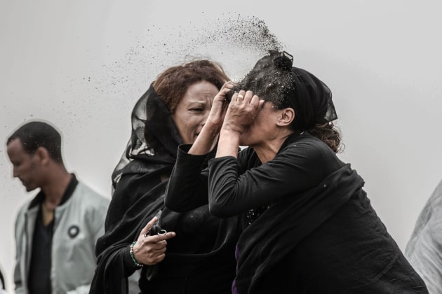 World Press Photo of the Year Nominee. &copy; Mulugeta Ayene, Ethiopia, Associated Press. Relative Mourns Flight ET 302 Crash Victim. A relative of a victim of the crash of Ethiopian Airlines Flight ET302 throws dirt in her face as she grieves at the crash site of Ethiopian Airlines Flight ET302, outside Addis Ababa, Ethiopia, on 14 March 2019.