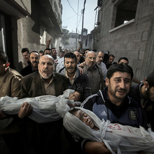 The World Press Photo of the Year for 2012 was taken by Swede Paul Hansen.
It was shot in, Gaza City, in the Palestinian Territories. The bodies of two-year-old Suhaib Hijazi and his elder brother Muhammad, almost four, were carried by their uncles to a mosque for their funeral, in Gaza City. The children were killed when their house was destroyed by an Israeli airstrike on 19 November.