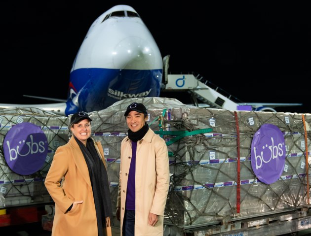 Bubs Australia CEO and Founder Kristy Carr, and Chairman Dennis Lin with the first cargo load of formula for Operation Fly Formula.