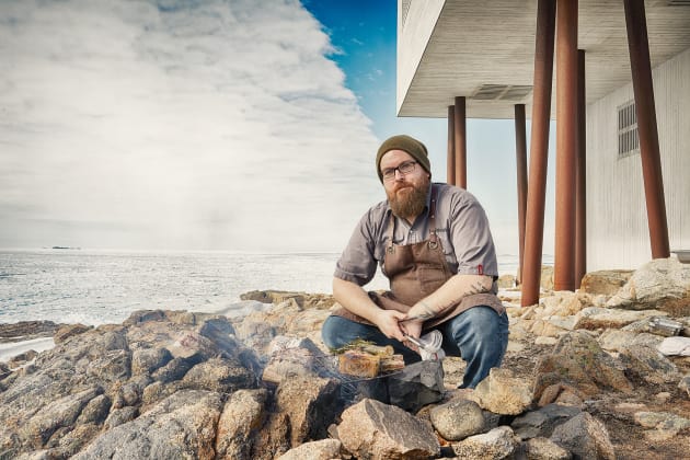 Chef Murray McDonald cooking over the fire pit outside the Inn. &copy; S&eacute;bastien Dubois-Didcock.