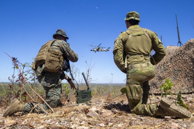 U.S. Marine Corps Capt. Benjamin Hovies with Command Element, Marine Rotational Force &ndash; Darwin, and Australian Army Sgt. Aaron Costas direct the flight path of a U.S. Air Force B-2 Spirit Bomber. (Defence)