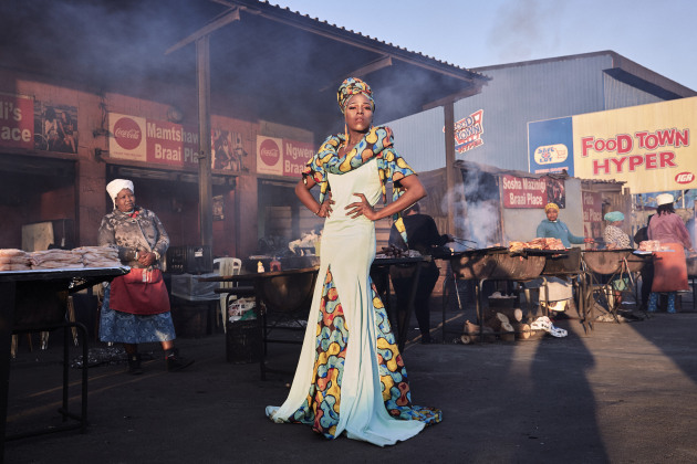 Portraits Singles Nominee. &copy; Lee-Ann Olwage, South Africa. Black Drag Magic - Portrait of a Drag Artist and Activist. Belinda Qaqamba Ka-Fassie, a drag artist and activist, poses at a shisanyama&mdash;a community space where women cook and sell meat&mdash;in Khayelitsha, a township located on the Cape Flats, near Cape Town, South Africa.