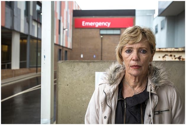 Remission. Tayla photographed her mother outside the Wagga Wagga Hospital to recreate her memory of collecting her mother from the hospital earlier this year after she had been told that her cancer was in remission. Whilst the photograph may not at first appear like the happy memory that it was, for both Tayla and her mum it was an emotionally charged moment. Tayla feels that her mother's expression still retains much of the trauma of the experience that she had been through, but also reveals a kind of bemused disbelief that she has been given the all clear. 
&copy; Tayla Martin, Australia, Shortlist, Student Focus, 2017 Sony World Photography Awards.