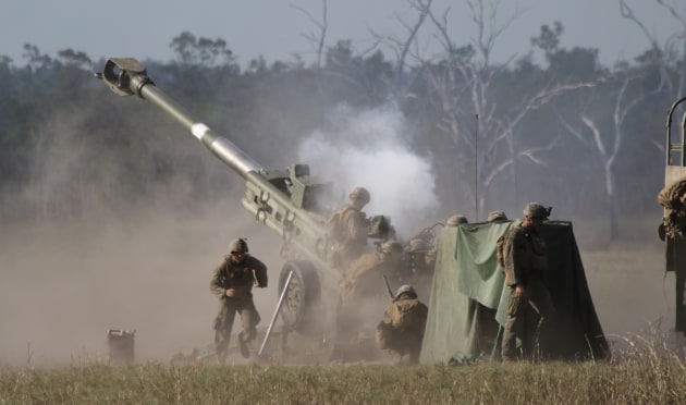 US Marines fire a 155mm M777A2 howitzer at simulated enemy positions. 
Credit: Nigel Pittaway