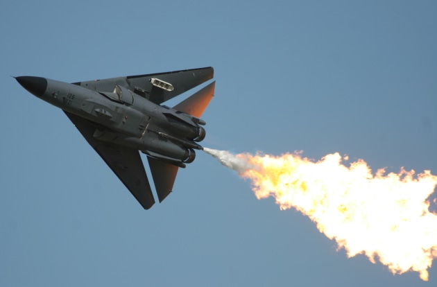 An F-111 performs its iconic dump and burn, an airshow favourite.