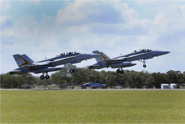F/A-18B Classic Hornets of No. 2 Operational Conversion Unit take off during Exercise Aces South held at RAAF Williamtown.