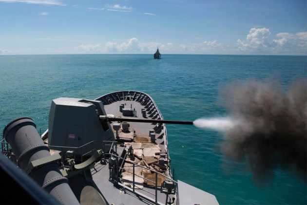 HMAS Warramunga fires her Mk 45 5 inch gun in the Northern Australian Exercise Area. C: Defence