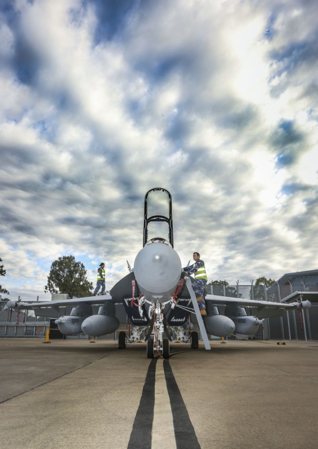 Leading Aircraftwoman Aimee-Rose Carter and Leading Aircraftman Fletcher Moulton perform routine checks on the newly arrived EA-18G Growler at No. 6 Squadron, RAAF Base Amberley. Credit: Defence