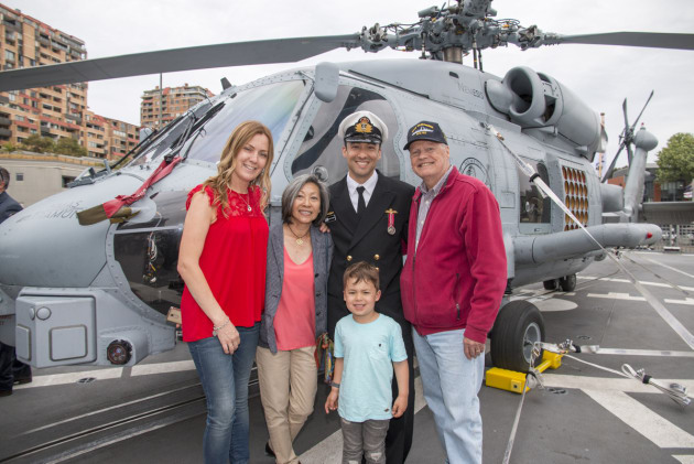 Crew and family pose in front of the Warramunga's MH-60 Romeo Seahawk prior to departure from Fleet Base East on October 9. Credit: Defence