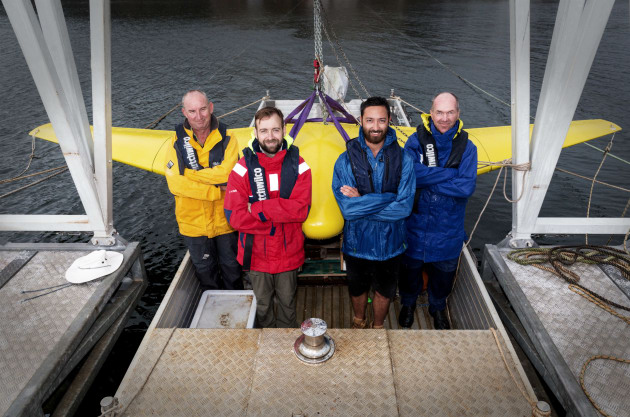 From Left, Neil Tavener, Bryan Clarke, Alan Lavery (from Ron Allum Deepsea Services), and Peter Formby from the Defence Science and Technology Group with the Sun Ray Glider at Woronora Dam, Sydney.