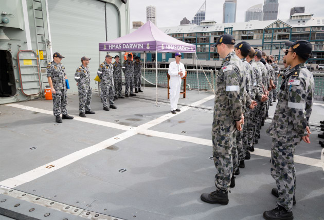 Department of Defence Capability Acquisition and Sustainment Group (CASG), Mr Andrew Wise, addresses Ex-HMAS Darwin's ship's company prior to accepting responsibility of the ship on behalf of CASG. Defence