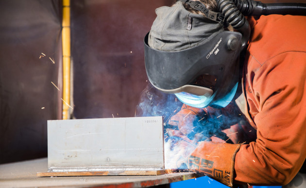A marine technician fabricates aluminium brackets at Fleet Support Unit-West. Defence