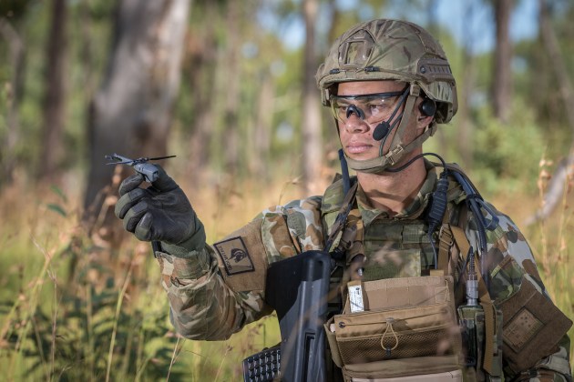 Australian Army soldier Trooper Sam Menzies with a PD-100 Black Hornet Nano unmanned aircraft vehicle. Defence