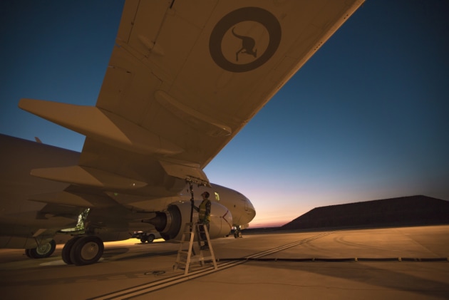 Dawn breaks as fuel is taken on-board a No. 11 Squadron P-8A Poseidon. Defence