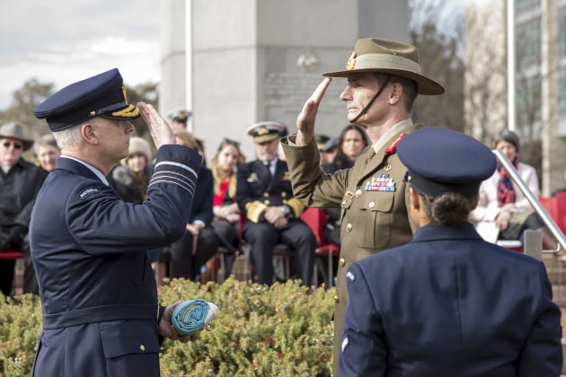 Outgoing Chief of Defence Force, Air Chief Marshal Mark Binskin, AC, salutes incoming Chief of Defence Force, General Angus Campbell, AO, DSC. Defence