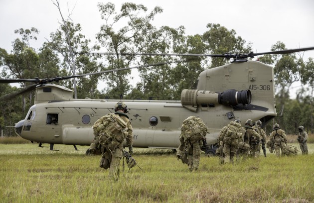 Australian Army soldiers of the 8th/9th Battalion, the Royal Australian Regiment, board a CH-47 Chinook during a non-combatant evacuation operation at Shoalwater Bay. Defence