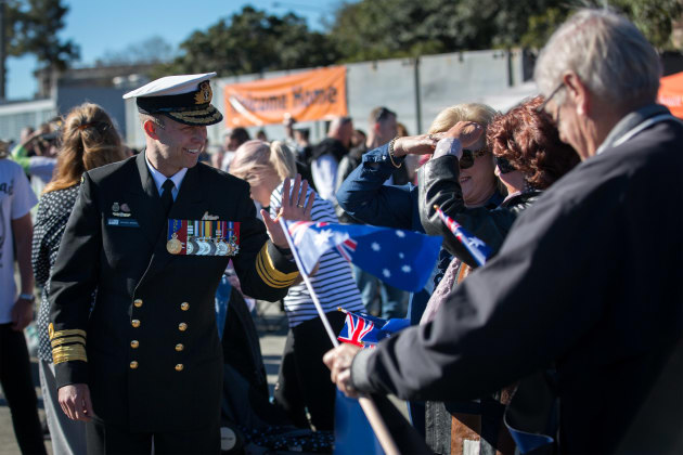 Chief of Navy Vice Admiral Michael Noonan talks to the families and friends of HMAS Warramunga before the ship is welcomed home to Fleet Base East. Defence