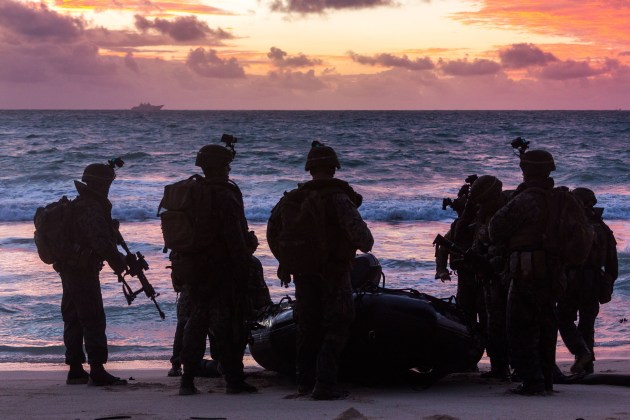 Soldiers from the 2nd Battalion, Royal Australian Regiment and United States Marines during an amphibious assault at Bellows Training Area. Defence