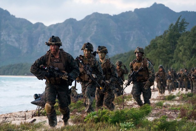 Soldiers of the 2nd Battalion, Royal Australian Regiment, and the United States Marines regroup after an amphibious insertion into Bellows Training Area. Defence